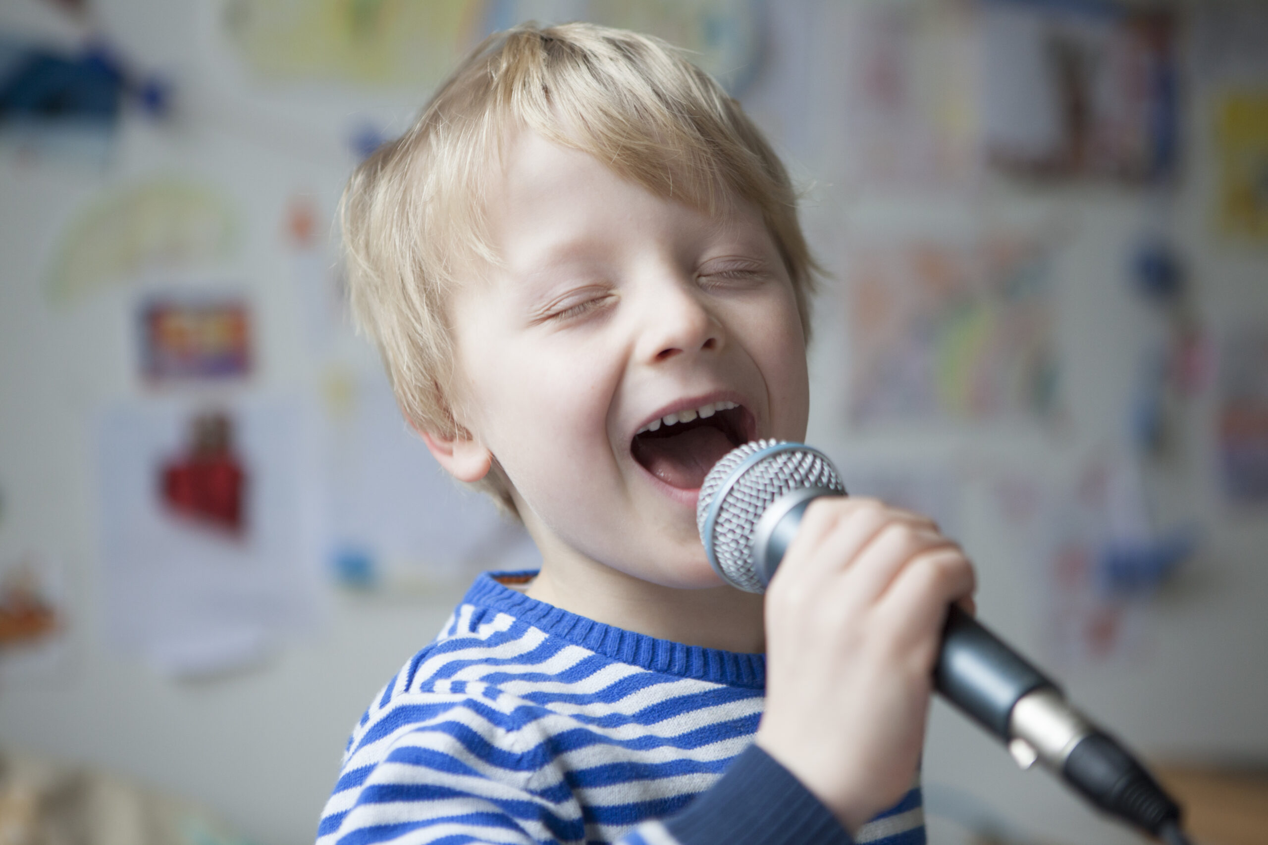 Portrait of singing little boy with microphone Portrait of singing little boy with microphone